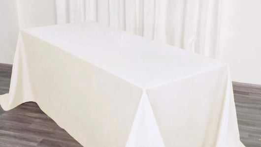 90” x 132” Off White Polyester Table Drape
